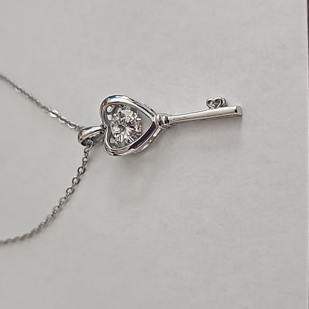 HEART Key necklace with floating princess cut CZ on a silver small link chain